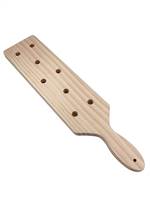 A wooden punishment paddle with eight holes to make it hurt more